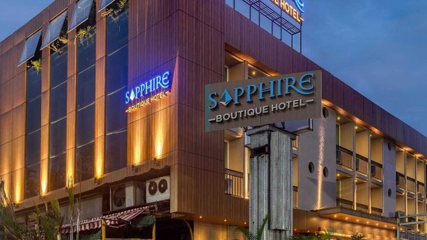 A modern hotel with a prominent 'Sapphire Boutique Hotel' sign. - Sapphire Boutique Hotel (Navi Mumbai)