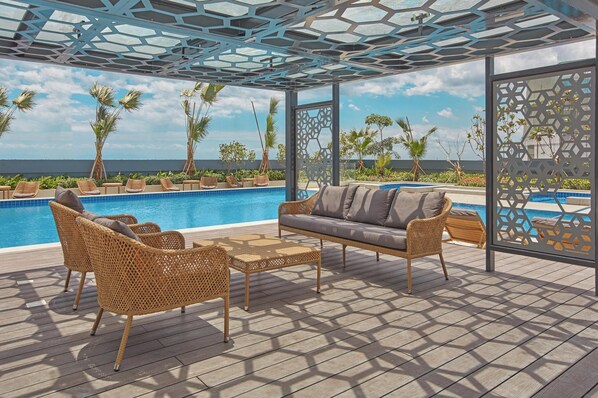 Outdoor pool, pool umbrellas, sun loungers