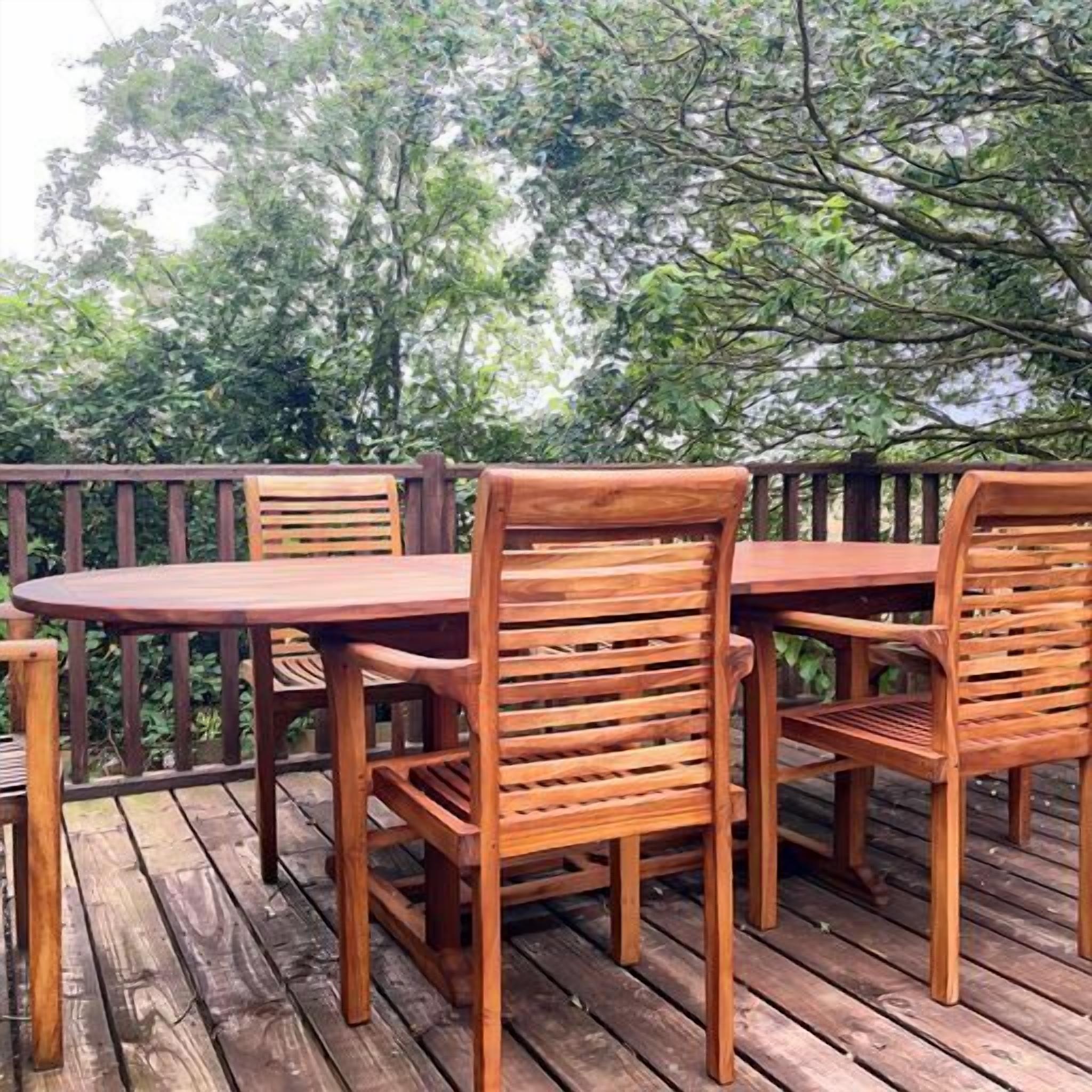 A wooden deck with a round table and four chairs.