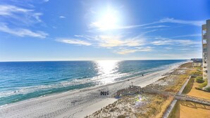 A beach with a wooden walkway leading to a gazebo, overlooking the ocean. - Shoreline Towers 1061 (Destin)