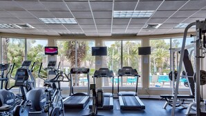 A gym with treadmills, elliptical machines, and weight equipment. - Destiny Casa (Destin)