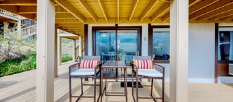 Ocean-view studio near golf with patio, beach gear, kitchenette, & partial AC