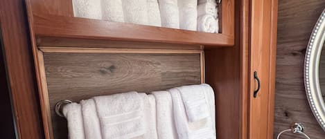 Hair dryer, towels, soap, toilet paper