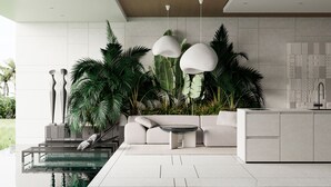 A modern living room with a sofa, coffee table, and decorative lamps. - GREEN FLOW Villas III Ubud (Ubud)