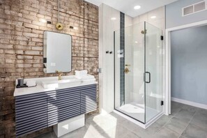 Shower, hair dryer, towels - Premiere king suite at The BlueJay (Grand Rapids)