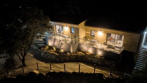 A two-story building with a stone staircase leading to a balcony. - Casa Léa (Sollacaro)