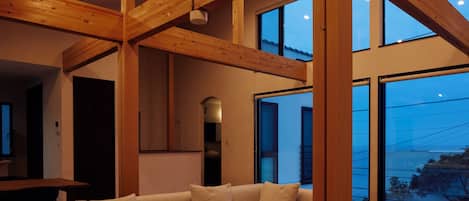 Design Villa | Living area | 100-inch Smart TV with cable channels