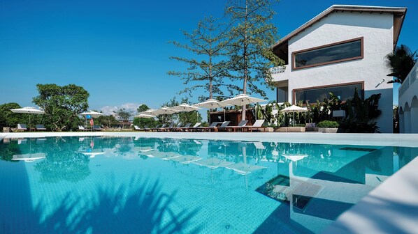 Outdoor pool, open 9:00 AM to 9:00 PM, pool umbrellas, pool loungers