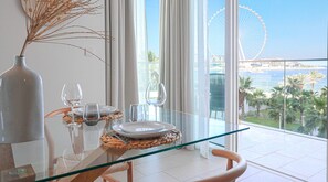 Enjoy a meal with a view of the Ferris wheel and water from this dining area.