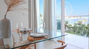 Enjoy a meal with a view of the Ferris wheel and water from this dining area.