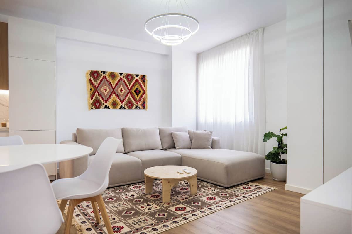 Deluxe Apartment | Living area | 50-inch Smart TV with cable channels, Netflix, streaming services