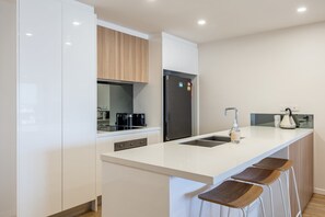 Fridge, microwave, oven, stovetop - Azure Oceanside Apartment At Kings Beach (Caloundra Region)