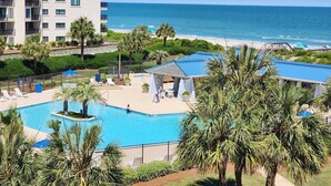 A hotel with a pool, beach view, and a multi-story building. - Crescent D4E Litchfield Beach (Pawleys Island)