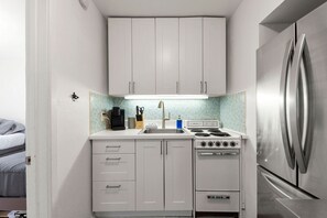 Fridge, microwave, oven, stovetop - 2 Bedroom Beach Condo in Michigan City | Steps from Lake Michigan (Michigan City)