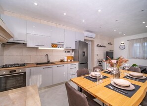 House (Two Bedroom Holiday Home with Pool) | Dining room