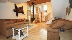 A spacious living room with two sofas, a coffee table, and a fireplace. - Tamarack #39: 2  BR, 2.5  BA Condominium in Mammoth Lakes, Sleeps 8 (Mammoth Lakes)