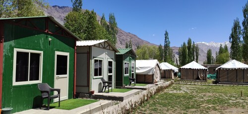 Cozy tents and huts surrounded by the mountains and nearby to riverside Nubra.