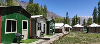 Cozy tents and huts surrounded by the mountains and nearby to riverside Nubra.