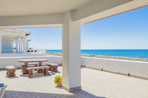 Casa de Evilina Beachfront Home with Spacious Deck and Well-Equipped Kitchen