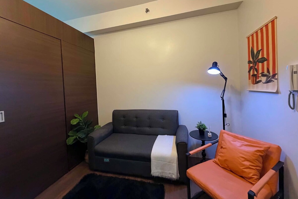 City Condo, 1 Bedroom, Kitchenette, City View | Living area | 50-inch Smart TV with digital channels, Netflix, streaming services
