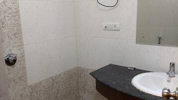Shower, rainfall showerhead, towels, soap