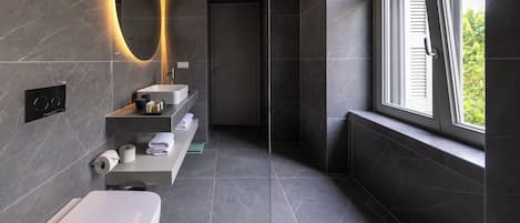 Shower, designer toiletries, hair dryer, bathrobes