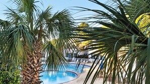 A pool surrounded by palm trees and a clear blue sky. - Dog Friendly @ Bungalows at Seagrove; 2 Blocks to Beach ~ Overlooks Pool/spa (Santa Rosa Beach)