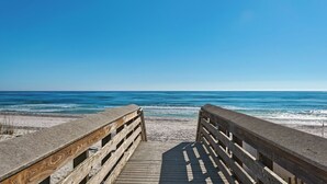 A wooden boardwalk leading to a beach with a clear view of the ocean. - Dog-friendly Gulf Side Cottage & 6 Minutes to Beach + Community Pool & Bikes (Santa Rosa Beach)