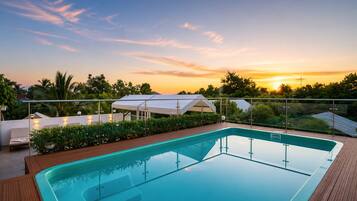 Outdoor pool, open 6:30 AM to 9:00 AM, pool umbrellas, sun loungers