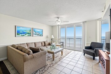 The private balcony off the main living room invites you to step outdoors.