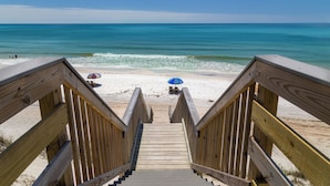 A wooden staircase leading to a beach with two umbrellas. - Gulf Front in Seagrove Beach With Sweeping Views (Santa Rosa Beach)