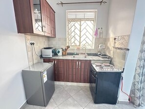 Fridge, microwave, oven, stovetop - JAM apartment in Najjera, Kampala (Kampala)