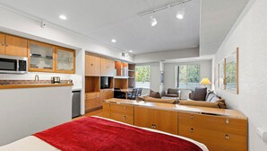 A compact studio apartment with a kitchenette, a dining area, and a living space. - 229 | Studio w/ AC unit - Stroll to the Village (Olympic Valley)