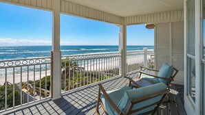 A covered balcony with a view of the beach and ocean. - Gulf-front, Private Pool ~ Stunning Gulf Views From All Levels + Beach Setup (Panama City Beach)