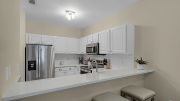 Condo, Multiple Beds, Patio, Pool View (Heron's Watch 5101) | Private kitchen | Coffee/tea maker