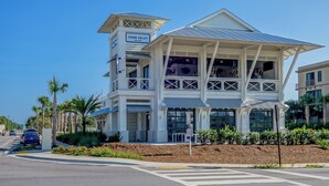 A two-story building with a sign for 'Shunk Gulley Oyster Bar'. - Blue Mountain Beach - Sleeps 12 - Steps From Pool (Santa Rosa Beach)