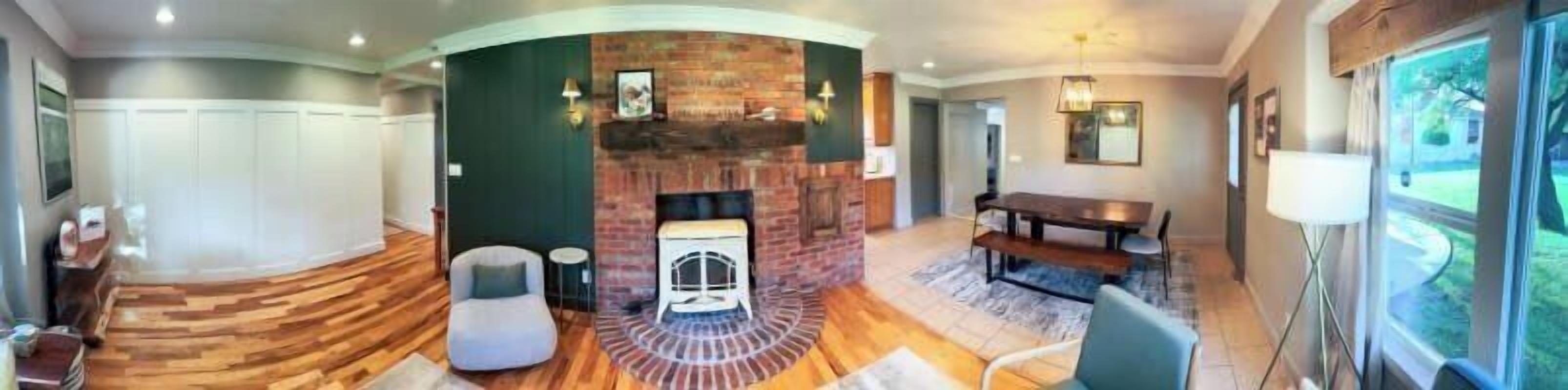 Cozy up by the fireplace in the spacious living room of Green Oasis, your perfect Kanab retreat.