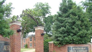The entrance to Austin Peay State University with a brick pathway leading to the main building. - Cozy Oasis of Downtown Clarksville (Clarksville)