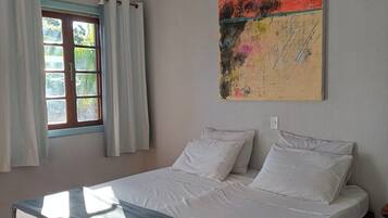 Suites Premium Pousada Buena Onda SC | 1 quarto, roupas de cama premium, individualmente decorados