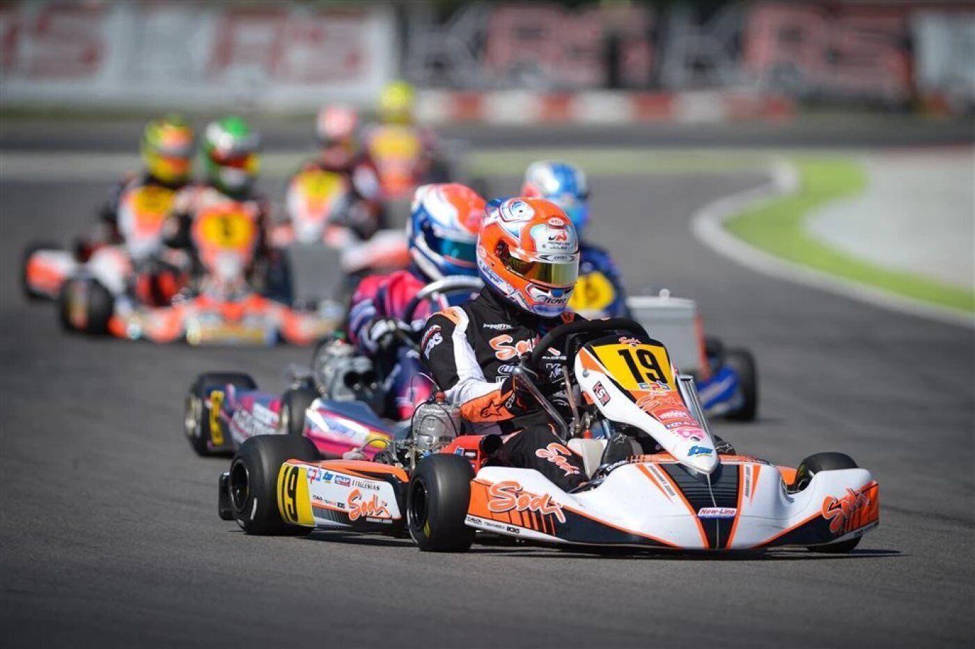 A go-kart race with multiple participants on a track.