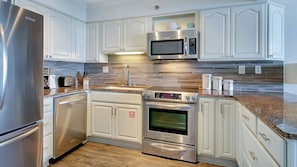 Condo, Multiple Beds, Balcony, Ocean View (BeachCrest 1002) | Private kitchen | Fridge, microwave, oven, dishwasher