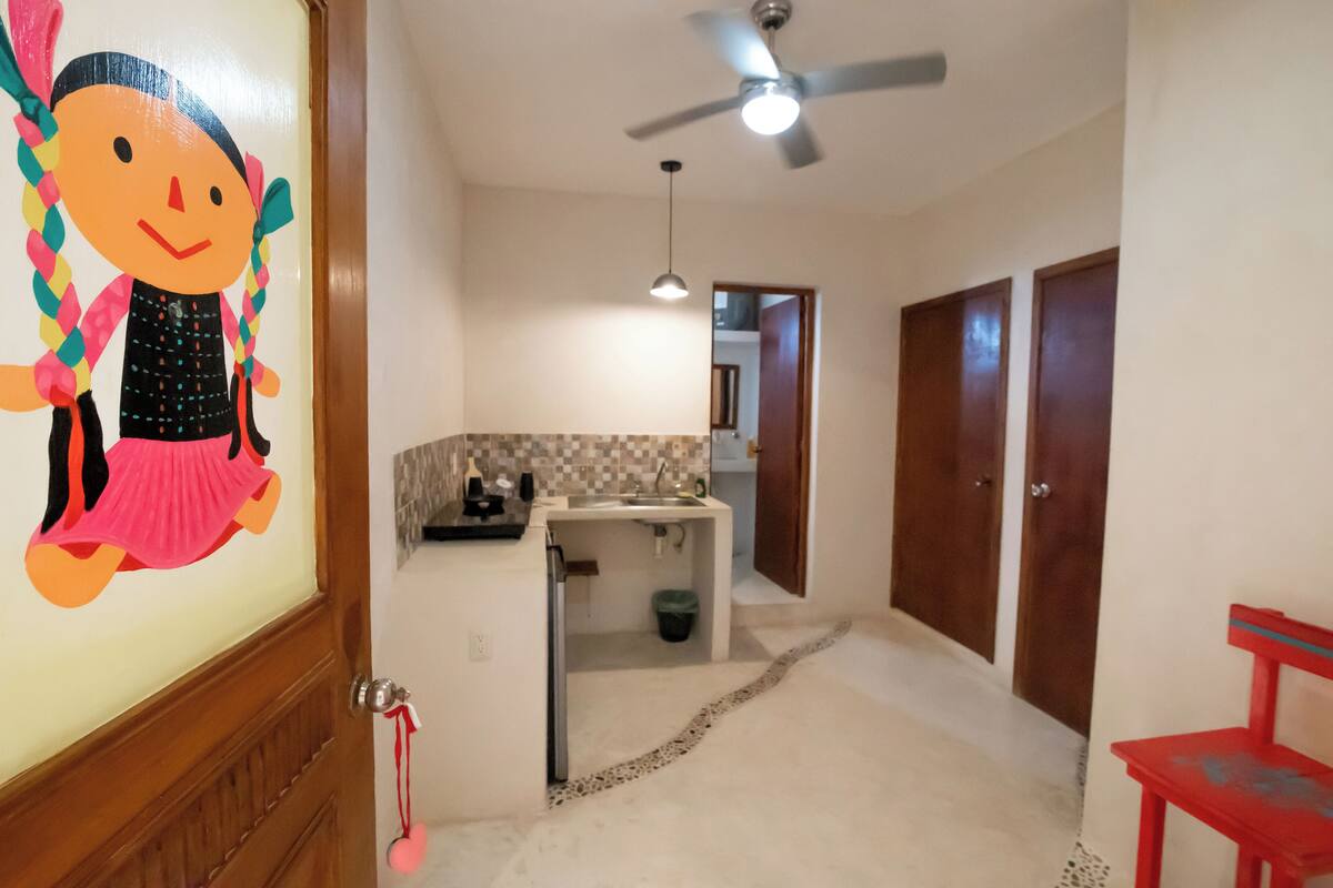 Family Studio Suite | Living area | 40-inch flat-screen TV with cable channels