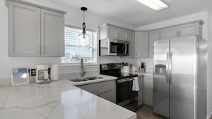 Condo, Multiple Beds, Patio, Ocean View (Beachside Villas 621) | Private kitchen | Coffee/tea maker