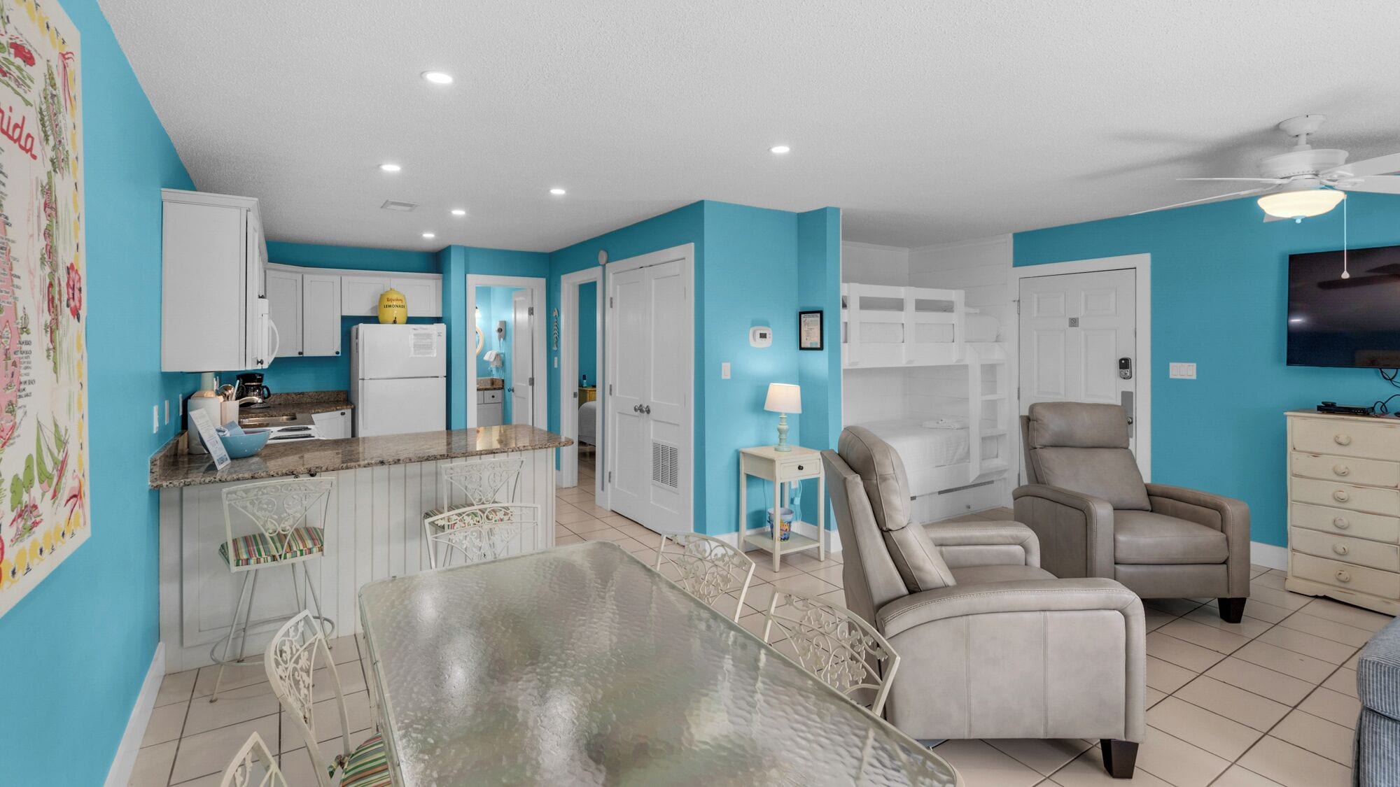 A compact living space with a kitchen, dining area, and a seating area.