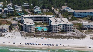 A coastal hotel with multiple buildings, a beachfront, and a swimming pool. - Dunes Of Seagrove (Santa Rosa Beach)