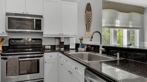 Condo, Multiple Beds, Balcony, Garden View (Grand Isle 206) | Private kitchen