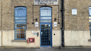 A brick building with a sign reading "The Grainstore 3 Seagull Lane". - Luxury Loft Style 2 Bed Apartment Next to Excel/o2 (London)
