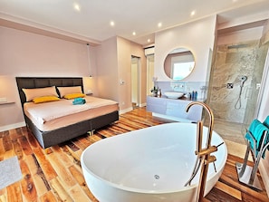 Shower, jetted bath, hair dryer, towels