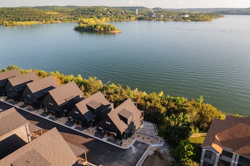 Waterfront 8 bdrm home w/ lake views, golf simulator, hot tub, & outdoor sauna!