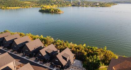 Waterfront 8 bdrm home w/ lake views, golf simulator, hot tub, & outdoor sauna!